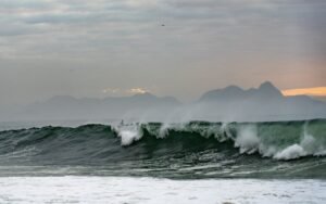 Surfer on the waves of the ocean in the Copacabana beach